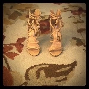 Nude strappy heels with tassels